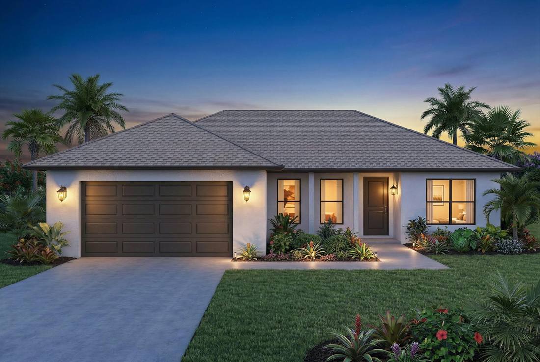 Maison avec porte de garage sectionnelle au crépuscule